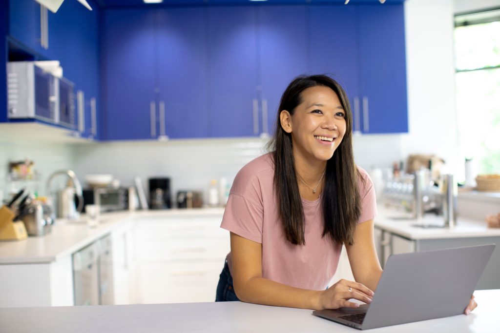 Smiling woman working at home